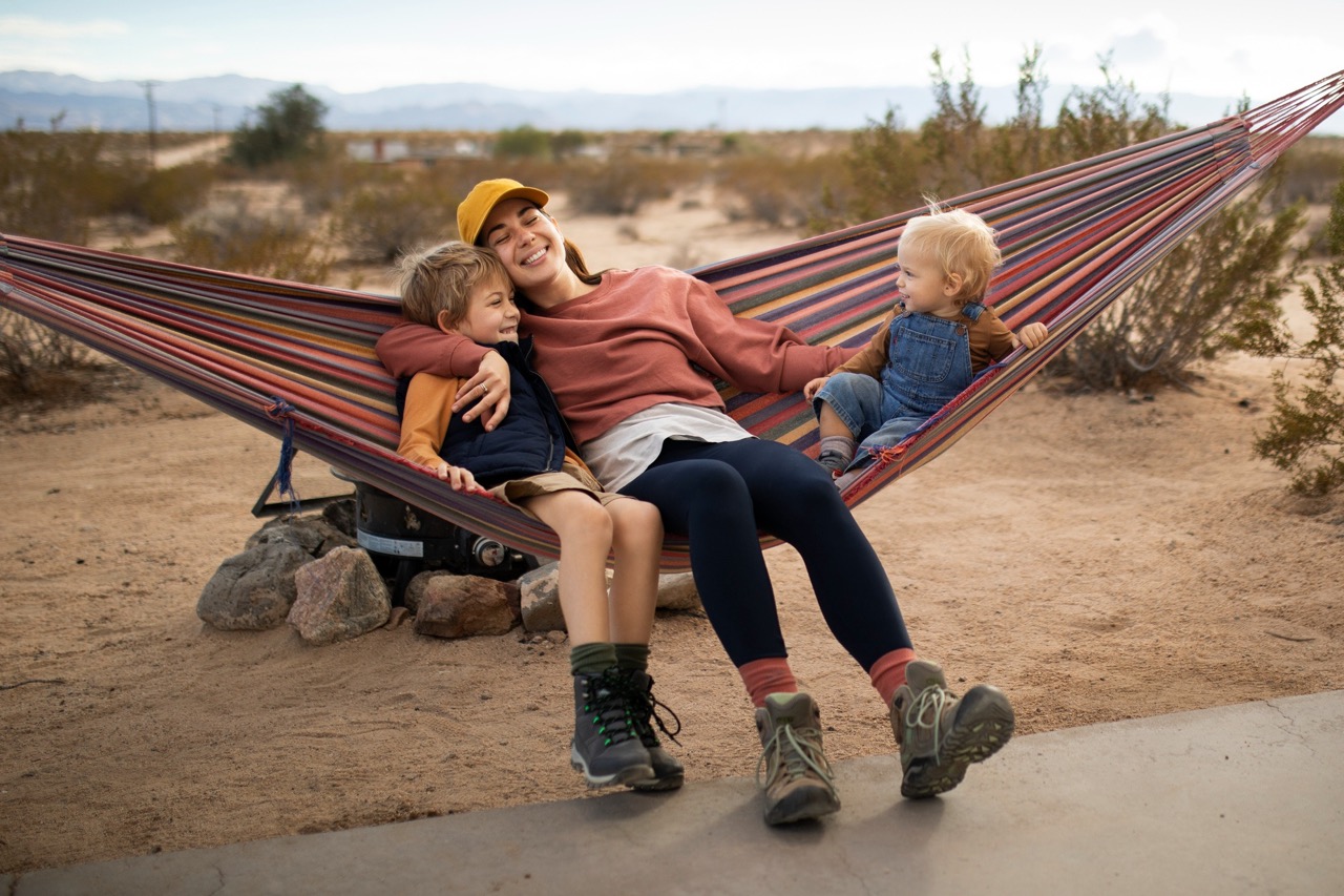full-shot-woman-kids-hammock