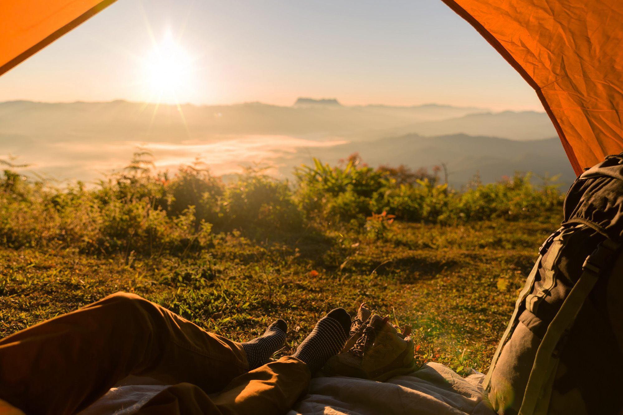 hiker-man-sitting-tourist-tent-by-travel-discovery-concept 2