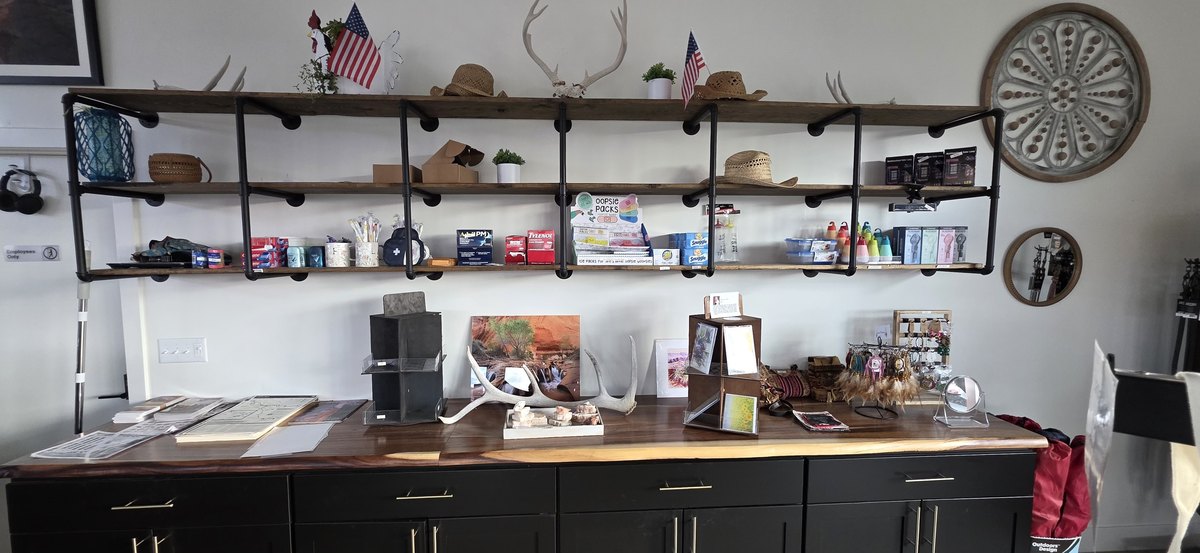 Gift shop shelves and counter with resort gear, souvenirs and travel essentials