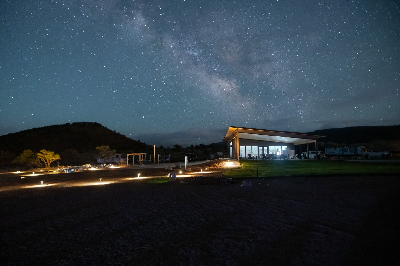 Milky Way over the resort clubhouse and softly lit pathways at night