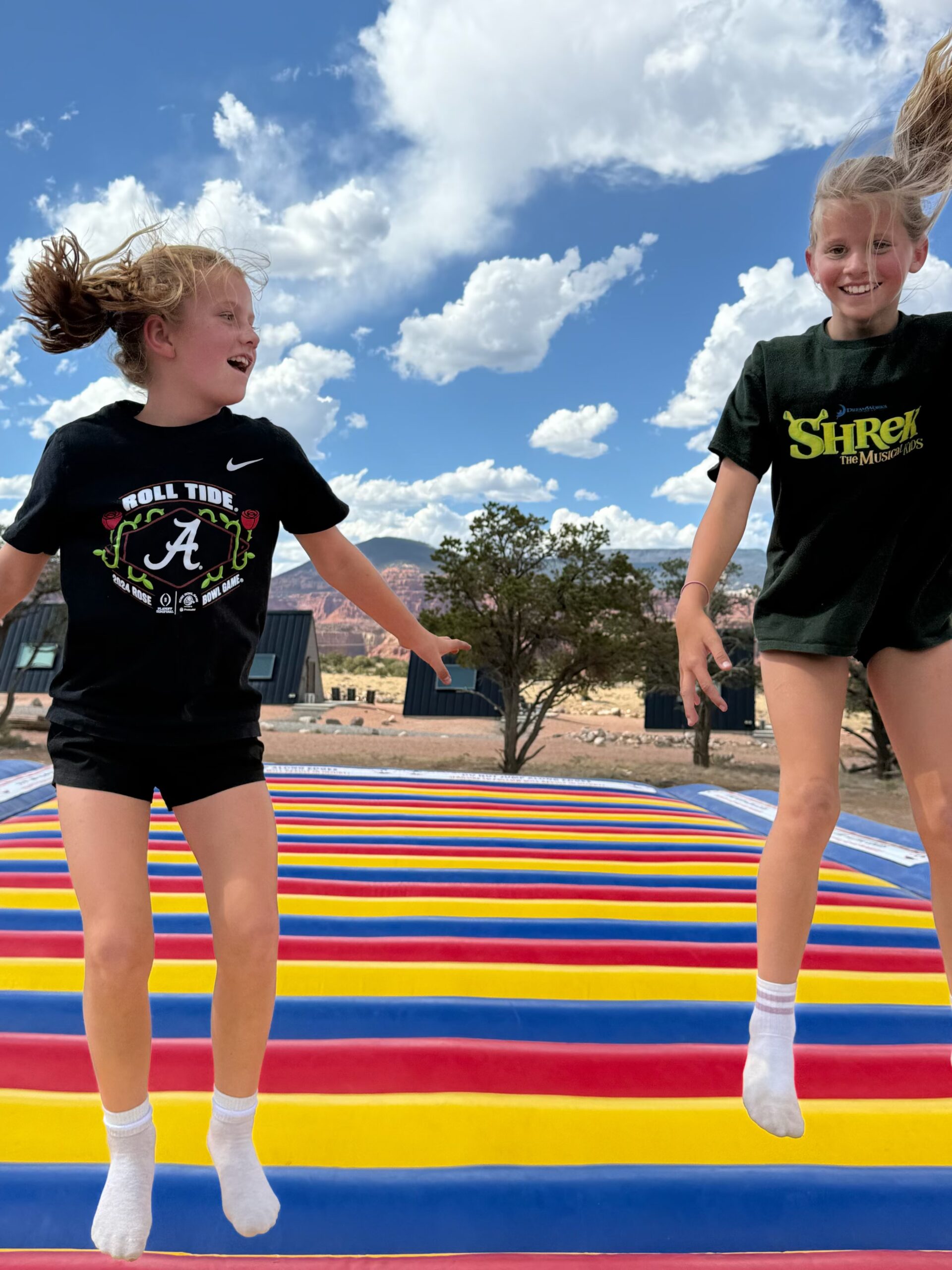 Children playing on the colorful jump pad